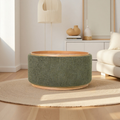 Moss green storage ottoman used as coffee table in a neutral toned living room