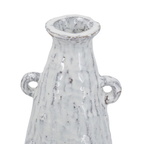 Close-up detail of the neck and decorative loop handles on the Aegean ceramic vase showing mottled white glaze with brown speckled texture and aged finish