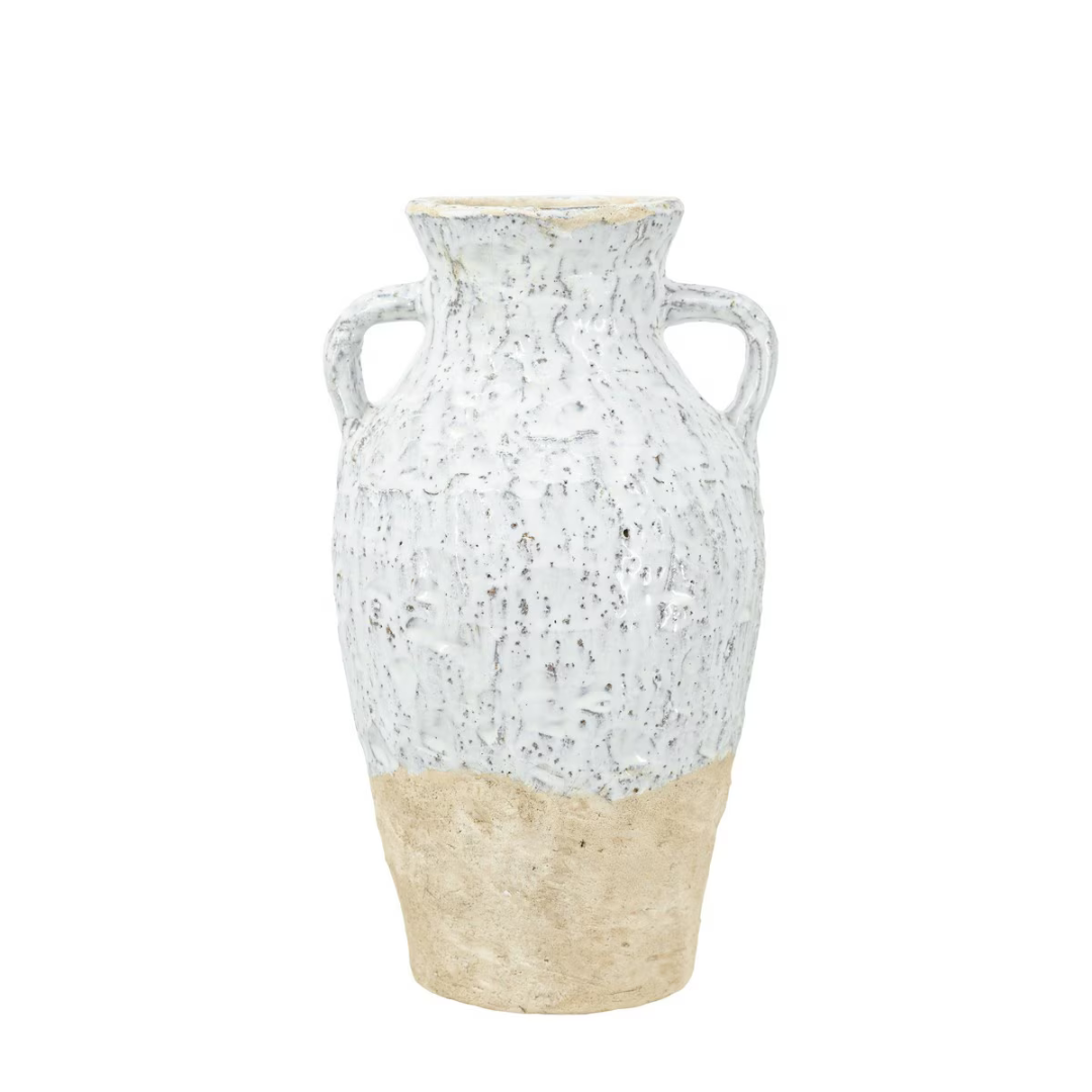 Classic amphora-shaped ceramic vase with two D-shaped handles, rounded body, heavily textured mottled white crackle glaze on upper half and raw sandy terracotta unglazed base, photographed on white background