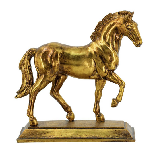 Gold horse statue on a white background
