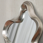 Close-up of brushed silver wavy sculpted frame on asymmetric wall mirror — Mish Lifestyle NZ