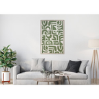 Living room with a gray sofa, coffee table, and abstract green artwork on the wall.