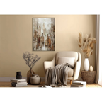 Cozy living room with a beige armchair, decorative plants, and a wall painting.