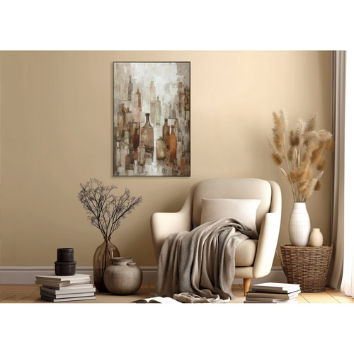 Cozy living room with a beige armchair, decorative plants, and a wall painting.