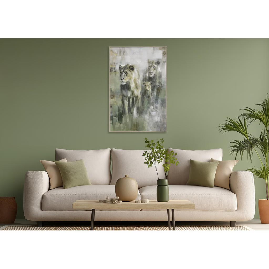 Living room with a beige sofa, coffee table, and wall art of lions.