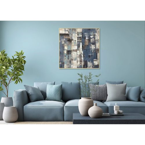 Modern living room with a blue sofa, decorative pillows, and a abstract painting on a light blue wall.