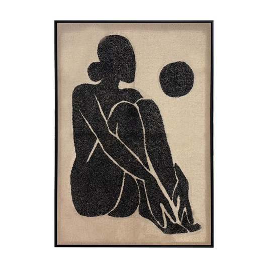 Silent Grace Hand-painted Framed Canvas Art- woman sitting on the floor with her legs bought up to her body. she is painted in black against a light brown canvas